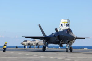 Pictured: Italian F-35B Lightning Jet launch from HMS Queen Elizabeth. HMS QUEEN ELIZABETH CROSS DECK WITH ITALIAN NAVY CAVOUR Today HMS QUEEN ELIZABETH exchanged F-35B from VFMA-211 squadron with an Italian Navy and Italian Air Force. The VFMA-211 USMC jets departed HMS Queen Elizabeth and landed on the Italian carrier CAVOUR. Two F35B Lightning Jet from the Italian Navy and Italian Air Force landed, refuelled and relaunched from HMS QUEEN ELIZABETH. This is the third nation that has landed jets on the UK Carrier. On completion of the refuelling HMS QUEEN ELIZABETH launched an Italian Navy F-35, Italian Air Force F-35, USMC F-35 and finally an F-35B from the UK 617 squadron. The jets then operated in the skies above the two carriers developing their interoperability and mutual understanding of procedures. HMS Queen Elizabeth is the deployed flag ship for Carrier Strike Group 21(CSG21). CSG21 will see the ship along with the Strike Group work with over 40 countries from around the world. The Strike Group will operate and exercise with other Countries Navies and Air Forces during the 7 month deployment. The Strike Group includes ships from the United States Navy, The Dutch Navy, and Marines from the US Marine Corps. As well as UK Frigates, Destroyers two RFA supply ships and air assets from 617 Sqn, 820 NAS, 815 NAS and 845 NAS. This will be the largest deployment of Fifth Generation Fighter Jets in history.